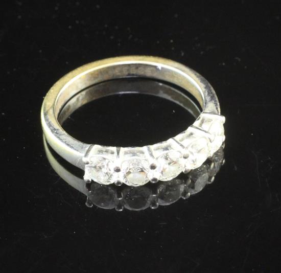 A modern 18ct white gold and five stone diamond half hoop ring, size M.